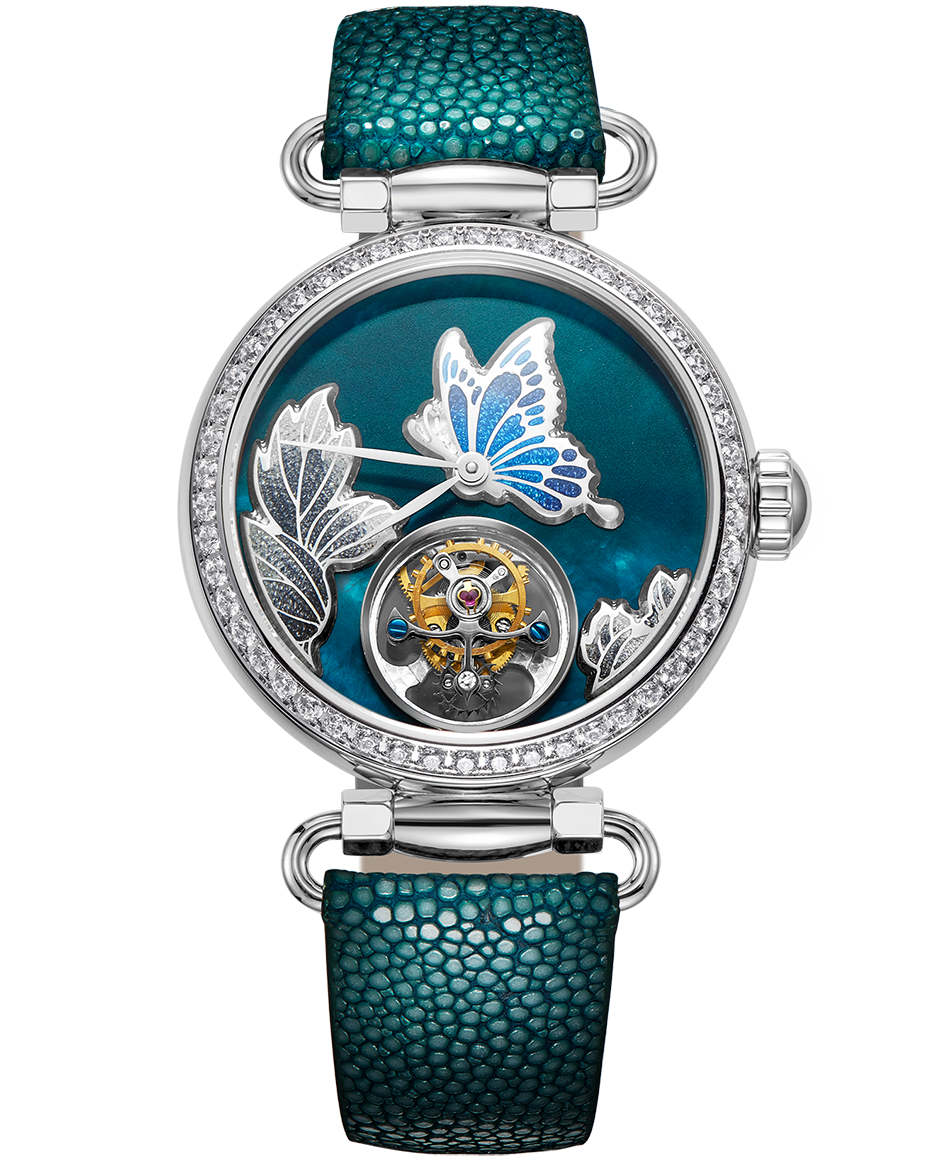 A luxury women's watch featuring a round silver-tone case encrusted with clear crystals, a turquoise mother-of-pearl dial with a butterfly and leaf design, and a visible mechanical movement. It is fitted with a textured teal-green strap.