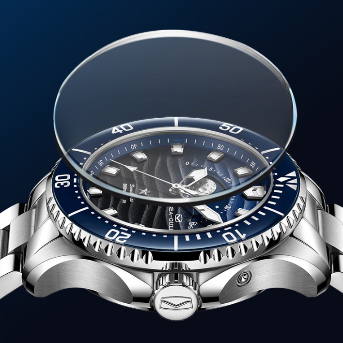A stainless steel wristwatch with a blue dial and bezel, shown with a transparent protective glass cover floating above the watch face against a dark blue gradient background.