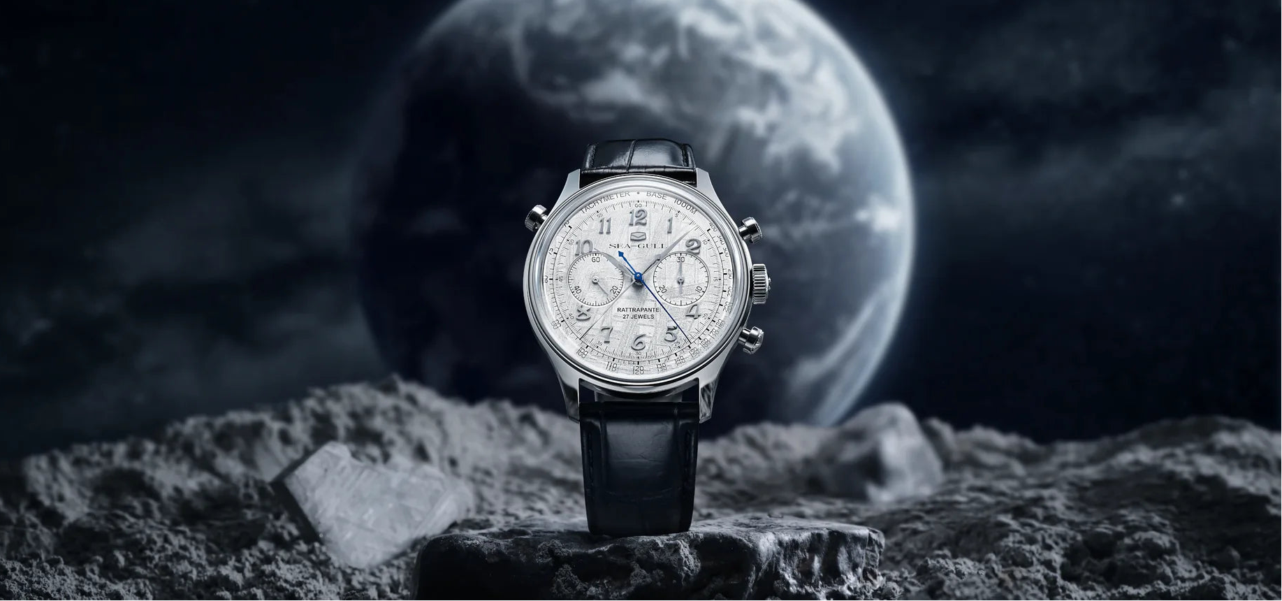 Watch on a rocky surface with a moon-like background